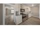 Modern kitchen boasts stainless steel appliances, updated cabinets, and neutral countertops at 632 Avenue D, Boulder City, NV 89005