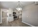 Well-lit kitchen with stainless steel appliances, including an oven, and a connecting doorway at 632 Avenue D, Boulder City, NV 89005