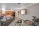 Open living area featuring a comfortable couch, decorative accents, and convenient access to the kitchen at 632 Avenue D, Boulder City, NV 89005