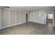 Spacious living room with wood-look floors, wall accents, and a built-in shelving unit at 632 Avenue D, Boulder City, NV 89005
