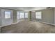 Bright living room with wood-look floors, bay window, and neutral paint at 632 Avenue D, Boulder City, NV 89005