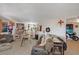 Bright living room boasting a cozy couch, eclectic decor, and tiled flooring at 632 Avenue D, Boulder City, NV 89005