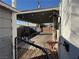 Outdoor area with covered patio and small red table and chairs at 632 Avenue D, Boulder City, NV 89005