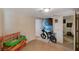Versatile room showing a motorcycle, storage and doorways to adjacent rooms at 632 Avenue D, Boulder City, NV 89005