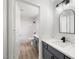 Modern bathroom with gray vanity and marble countertop at 6442 Bright Nimbus Ave, Las Vegas, NV 89139