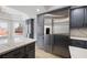 Modern kitchen with stainless steel refrigerator and gray cabinetry at 6442 Bright Nimbus Ave, Las Vegas, NV 89139