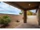 Covered patio with brick flooring and gravel yard at 6925 Cuddy Falls Pl, North Las Vegas, NV 89084