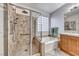 Large bathroom with walk-in shower and soaking tub at 7286 Laramie Ave, Las Vegas, NV 89113