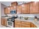 Kitchen with stainless steel appliances and granite countertops at 7286 Laramie Ave, Las Vegas, NV 89113