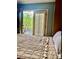 Bedroom with a comfortable bed and access to a private balcony at 738 Tam O Shanter, Las Vegas, NV 89109