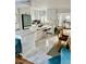 Bright kitchen boasts an island, stainless steel appliances, and white cabinetry at 738 Tam O Shanter, Las Vegas, NV 89109