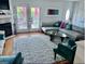 Spacious living room with a cozy fireplace and large windows at 738 Tam O Shanter, Las Vegas, NV 89109