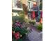 Charming patio with brick pavers, colorful flowers, and seating area at 738 Tam O Shanter, Las Vegas, NV 89109