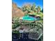 Community pool with lounge chairs and lush landscaping at 738 Tam O Shanter, Las Vegas, NV 89109