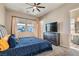 Spacious bedroom with a dresser and en-suite bathroom at 757 Goodman Cove St, Henderson, NV 89011