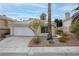 House front with a garage and landscaping at 7701 Sea Cliff Way, Las Vegas, NV 89128