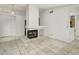 Living room featuring a fireplace and tile floors at 7701 Sea Cliff Way, Las Vegas, NV 89128