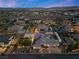 Night view of house and neighborhood, showing a large property and pool at 7869 Wheeler Creek Ct, Las Vegas, NV 89113