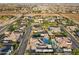 Aerial view of homes in a new development, highlighting a property with a pool at 7869 Wheeler Creek Ct, Las Vegas, NV 89113