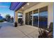 Covered patio with sliding glass doors leading to the backyard at 7869 Wheeler Creek Ct, Las Vegas, NV 89113