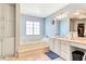 Elegant bathroom featuring a large soaking tub and double vanity at 830 Park Ln, Henderson, NV 89015