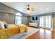 Main bedroom with hardwood floors, a ceiling fan, and direct access to the backyard at 830 Park Ln, Henderson, NV 89015
