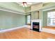 Spacious living room featuring hardwood floors, fireplace, and built-in window seating at 830 Park Ln, Henderson, NV 89015