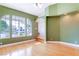 Bright living area with hardwood floors and large windows offering ample natural light at 830 Park Ln, Henderson, NV 89015