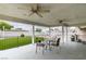 Covered patio with seating area and backyard view at 830 Park Ln, Henderson, NV 89015