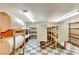 Large storage room with shelving and a checkered floor at 830 Park Ln, Henderson, NV 89015