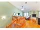 Open view of living room and kitchen from the upstairs, showcasing a wooden staircase at 830 Park Ln, Henderson, NV 89015