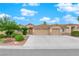 Single-story house with a two-car garage and desert landscaping at 913 San Bruno Ave, Henderson, NV 89002