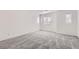 Spacious bedroom with neutral carpet and multiple windows for natural light at 9140 Silk Threads Ave, Las Vegas, NV 89149