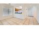 Dining area with tiled flooring, natural light, and a view of the kitchen at 9140 Silk Threads Ave, Las Vegas, NV 89149