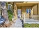 The home's entry showing the front door, small porch with white railings and the steps leading up to the porch at 9140 Silk Threads Ave, Las Vegas, NV 89149