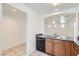 Kitchen with a stainless steel sink and breakfast bar with an open view to the living room at 9140 Silk Threads Ave, Las Vegas, NV 89149
