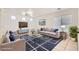 Bright living room with modern furniture, patterned rug, and large windows at 9140 Silk Threads Ave, Las Vegas, NV 89149