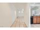 Image of living space showcasing tile flooring, neutral paint, and an open-concept layout connecting to kitchen at 9140 Silk Threads Ave, Las Vegas, NV 89149