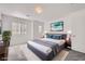 Well-lit bedroom with carpet flooring, decor, and a large window at 9140 Silk Threads Ave, Las Vegas, NV 89149