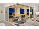 An outdoor balcony space with seating offers open-air access to the living area, and features stunning city views at 9145 Las Manaitas Ave # 401, Las Vegas, NV 89144