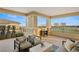 Large outdoor balcony with comfortable seating and views of the city and golf course at 9145 Las Manaitas Ave # 401, Las Vegas, NV 89144