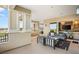 Spacious covered balcony with lounge furniture, offering scenic views of the city and golf course at 9145 Las Manaitas Ave # 401, Las Vegas, NV 89144