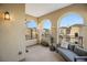 Spacious balcony features elegant arches, outdoor seating, and views of neighboring homes at 9145 Las Manaitas Ave # 401, Las Vegas, NV 89144