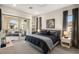 Modern bedroom features soft carpeting, balcony access, and neutral paint at 9145 Las Manaitas Ave # 401, Las Vegas, NV 89144
