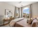Bright bedroom with large windows, soft carpeting, and neutral paint at 9145 Las Manaitas Ave # 401, Las Vegas, NV 89144