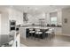 Modern kitchen with stainless steel appliances and stylish island seating at 9145 Las Manaitas Ave # 401, Las Vegas, NV 89144