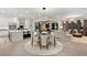 Open-concept living space with modern kitchen, dining area, and comfortable living room at 9145 Las Manaitas Ave # 401, Las Vegas, NV 89144