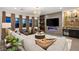 Cozy living room featuring modern decor, a stylish bar area, and comfortable seating at 9145 Las Manaitas Ave # 401, Las Vegas, NV 89144