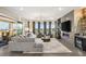 Spacious living room has modern decor, a fireplace, and a balcony view at 9145 Las Manaitas Ave # 401, Las Vegas, NV 89144