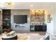 Chic living room with fireplace, bar area, and contemporary furnishings at 9145 Las Manaitas Ave # 401, Las Vegas, NV 89144